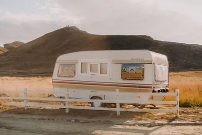 Vintage caravan parked in open countryside